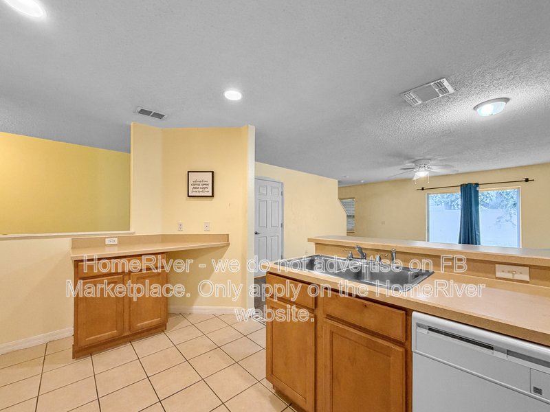Townhome with a garage property image