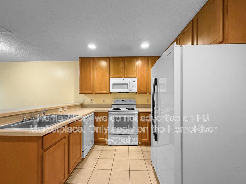 Townhome with a garage property image