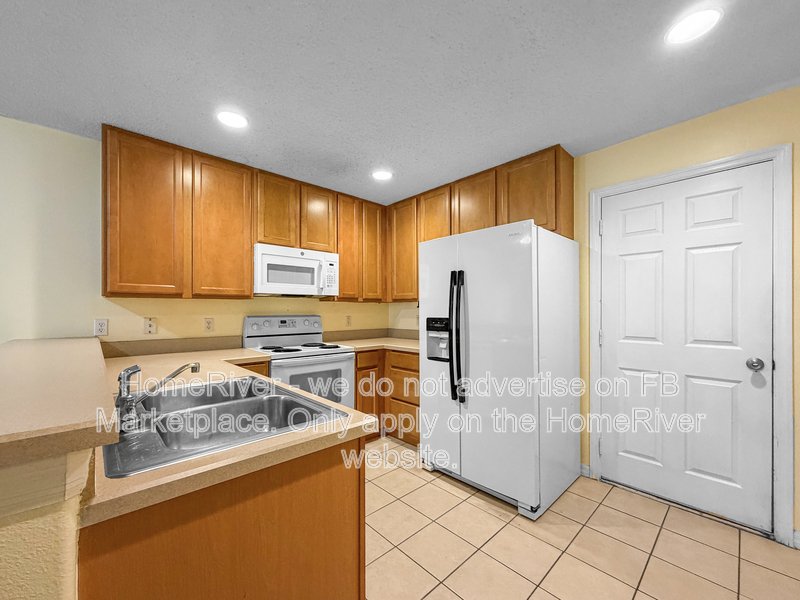 Townhome with a garage property image