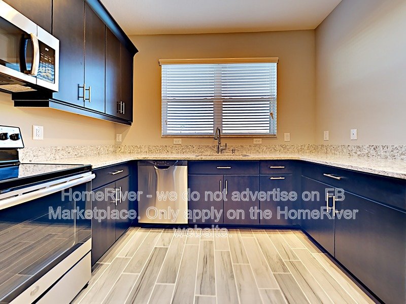 Gated Wiregrass Ranch Townhome with Pond View | Water Included! property image