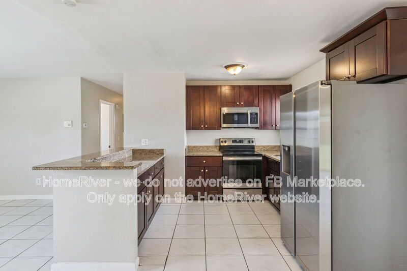 4 bedroom home with fenced yard property image